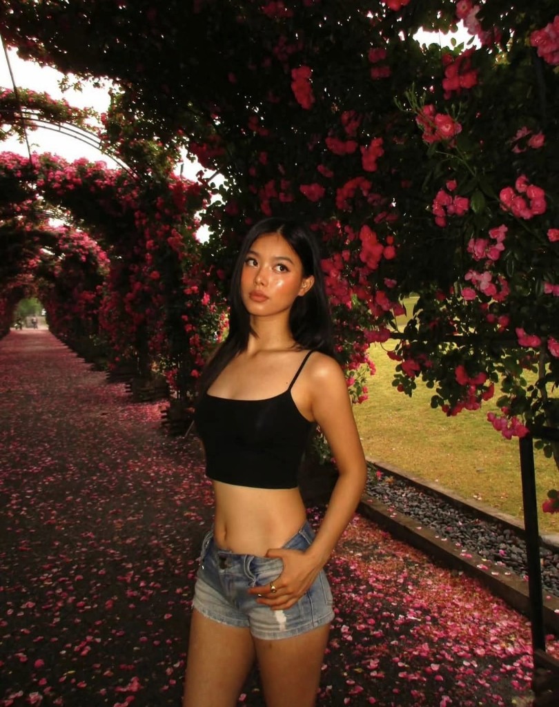 Lily under a rose arch